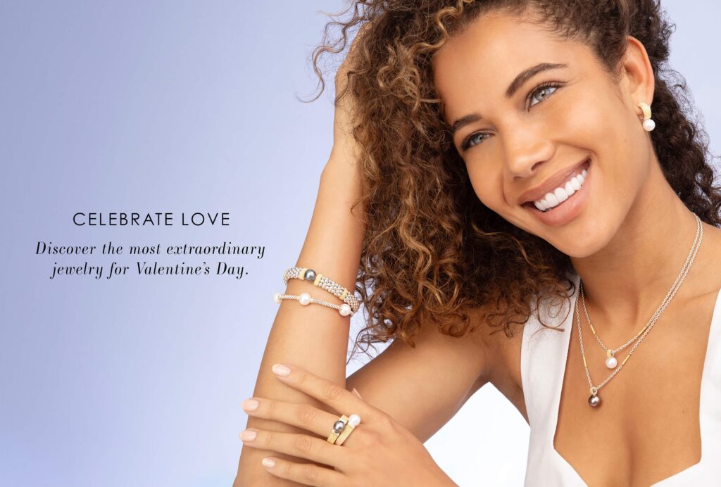 Image of women smiling wearing jewelry and product displayed