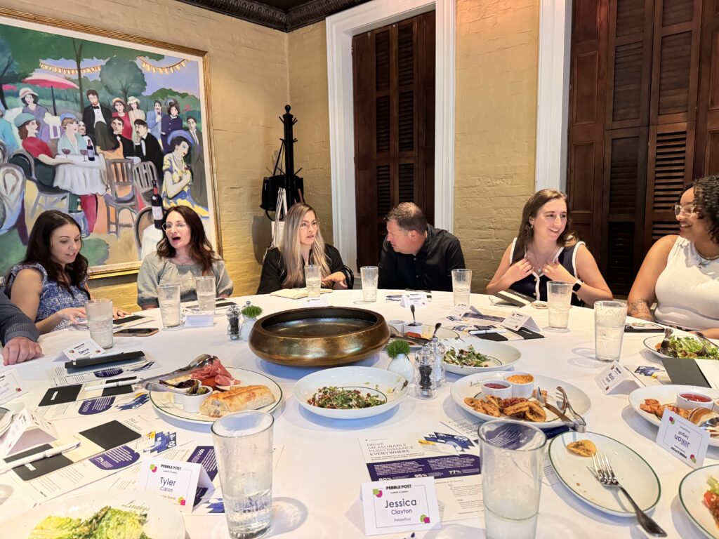 people eating lunch around a table